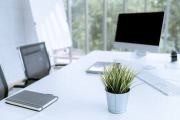 Fototapete - Modern white desk work table with computer laptop and stationary in home office