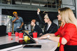 © sofiko14 - African american man in casual wear standing near the glass office wall with financial points, explaining planning and business strategies to colleagues, creative solutions on brainstorming session