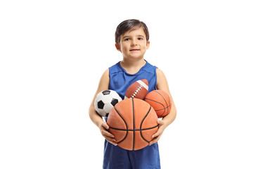 Sticker - Little boy holding many balls from different sports