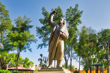 Coyoacan, Mexico City, Mexico-20 April, 2019: Miguel Hidalgo Statue in front of Parish of San Juan Bautista on Hidalgo square in Coyoacan