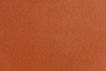 Wall Mural - abstract orange glitter paper texture background or backdrop. empty shimmer paper or shiny paperboar