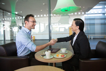 business meeting in a cafe to discuss future plans.