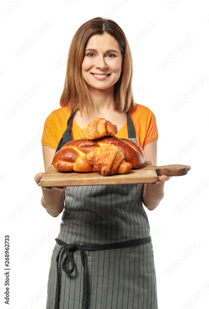 Female chef with bakery products on white background