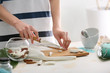 © Pixel-Shot - Woman preparing body scrub at table