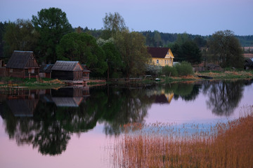 Canvas Print - Landscape with the image of village on lake Seliger in Russia