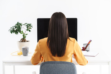 Wall Mural - Photo of successful brunette businesswoman working on big computer in bright office