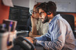 © BalanceFormCreative - Two programmers working on new project.They working late at night at the office.
