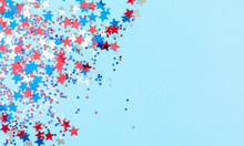 4th Of July American Independence Day. Red, Blue And White Star Confetti Decorations On Blue Background. Flat Lay, Top View, Copy Space