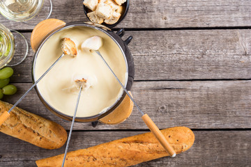 Cheese fondue with bread wine and grape