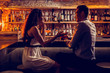© Viacheslav Yakobchuk - Young lovely couple sitting at the bar stand and talking