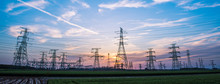 Silhouette Of Power Supply Facilities At Sunset