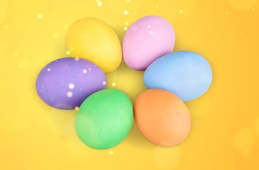 Poster - Colorful Easter eggs close up on yellow background