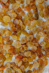 Sticker - Background from light yellow raisins. Close-up.