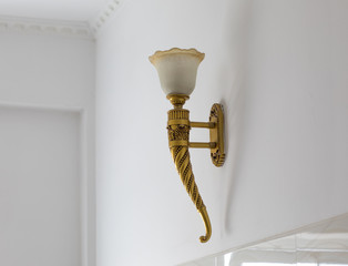 Sticker - gilded vintage lamp on a white wall