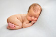 © Oksana - Sleeping newborn boy in the first days of life on white background