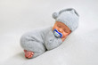 © Oksana - Sleeping newborn boy with baby's dummy in the first days of life on white background