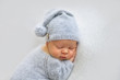 © Oksana - Sleeping newborn boy in the first days of life on white background