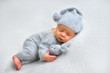 © Oksana - Sleeping newborn boy in the first days of life on white background