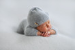 © Oksana - Sleeping newborn boy in the first days of life on white background