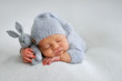 © Oksana - Sleeping newborn boy in the first days of life on white background