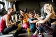 © BGStock72 - Friends in sportswear talking  together while standing in a gym after a workout