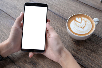 Business woman using smartphone in caffee shop. smart phone or mobile with blank screen and can be add your texts or others, tecnology concept.