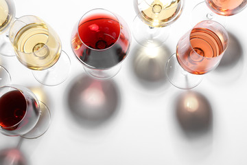 Wall Mural - Different glasses with wine on white background, top view