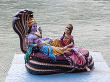 Statue Of Vishnu And Lakshmi On The Ganges Coast In Rishikesh