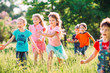 © davit85 - Large group of kids, friends boys and girls running in the park on sunny summer day in casual clothes .