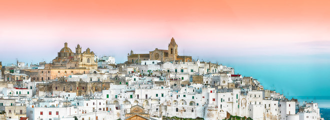 Ostuni white town skyline at sunrise