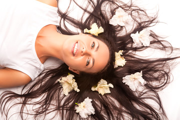 Portrait of Beautiful Caucasian Brunette Woman Laying on Floor With Hair Outspread