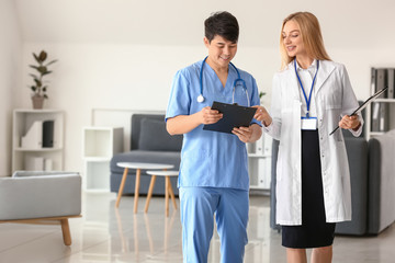 Female doctor and male medical assistant in clinic