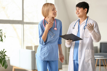 Canvas Print - Male doctor and female medical assistant in clinic