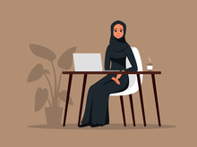 Young Arab Girl Sitting In Comfortable Armchair At The Table With Laptop. Muslim Business Woman Wearing Hijab Working At Home Or In Office. Colored Vector Illustration In Flat Cartoon Style.