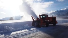A Snowplow Clears The Road Of A Fresh Snow