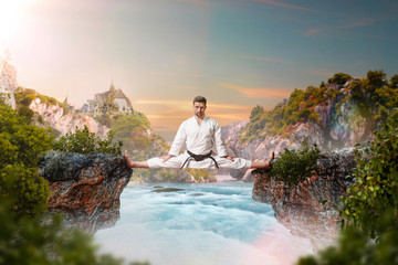 Wall Mural - Martial arts master in kimonodo sitting on splits