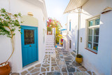Fototapeta Uliczki - Street of Greek village with white houses