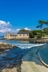 Wall Mural - Berder island, in Brittany, in the Morbihan gulf, path covered by the sea at rising tide