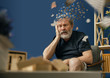 Drown image of losing of mind. Old bearded man with alzheimer desease sitting and suffering from headache. Illness, memory loss due to dementia, healthcare, neurological disorder, depression.