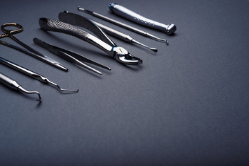 Dental instruments composed on gray background with copy space