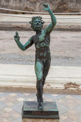 Pompeii, Italy. 04-22-2019. Statue  in antique roman house at  Pompeii, Italy.