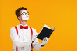 © Rychko Yevhen - portrait of mime man artist reading book isolated on yellow background. copy space for text