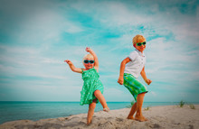 Cute Boy And Girl Dance At Beach, Kids Enjoy Vacation At Sea