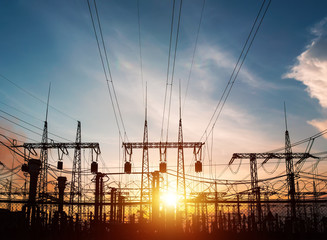 High-voltage power lines. Electricity distribution station. high voltage electric transmission tower. Distribution electric substation with power lines and transformers.