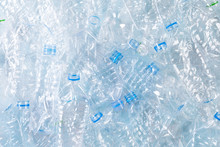 Top View Of Blue Plastic Bottles Background. Recycle Concept
