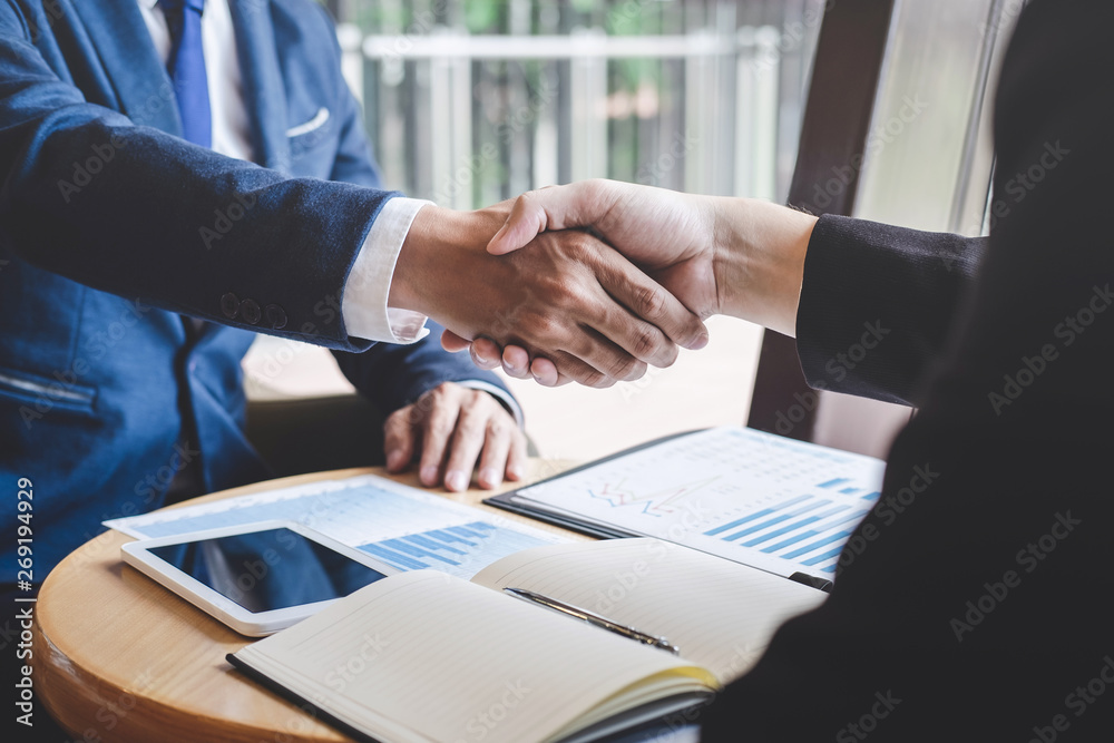 Handshake of two business people after contract agreement become a partner - obrazy, fototapety, plakaty 