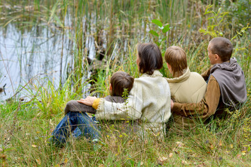 Wall Mural - Portrait of family of four in park