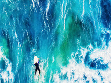 Surfer Rises On Crest Of Wave In Blue Ocean. Aerial Top View