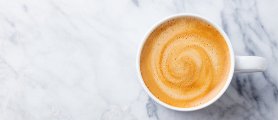 Canvas Print - Coffee, espresso in white cup of marble table background. Top view. Copy space.