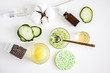 Top view of ingredients for preparing homemade cosmetics - face mask of fresh cucumber, a number of slices of fresh cucumbers, honey, egg yolk, oatmeal, napkins. Natural skin care